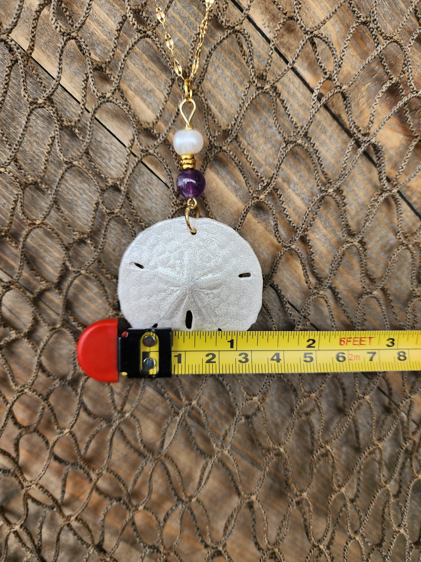 Genuine handmade sand dollar necklace, accented with amethyst and fresh water pearl beads. Natural sand dollar pendant. Boho beach jewelry.