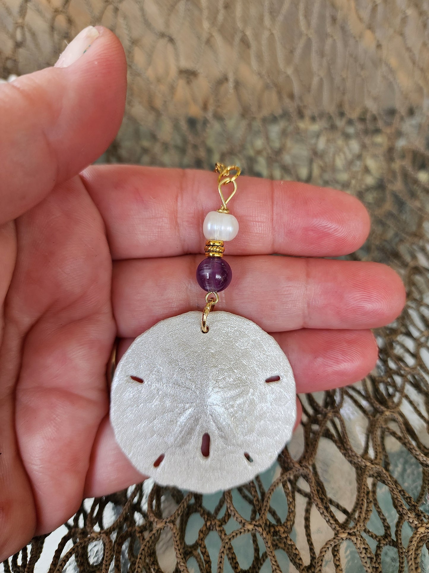 Genuine handmade sand dollar necklace, accented with amethyst and fresh water pearl beads. Natural sand dollar pendant. Boho beach jewelry.