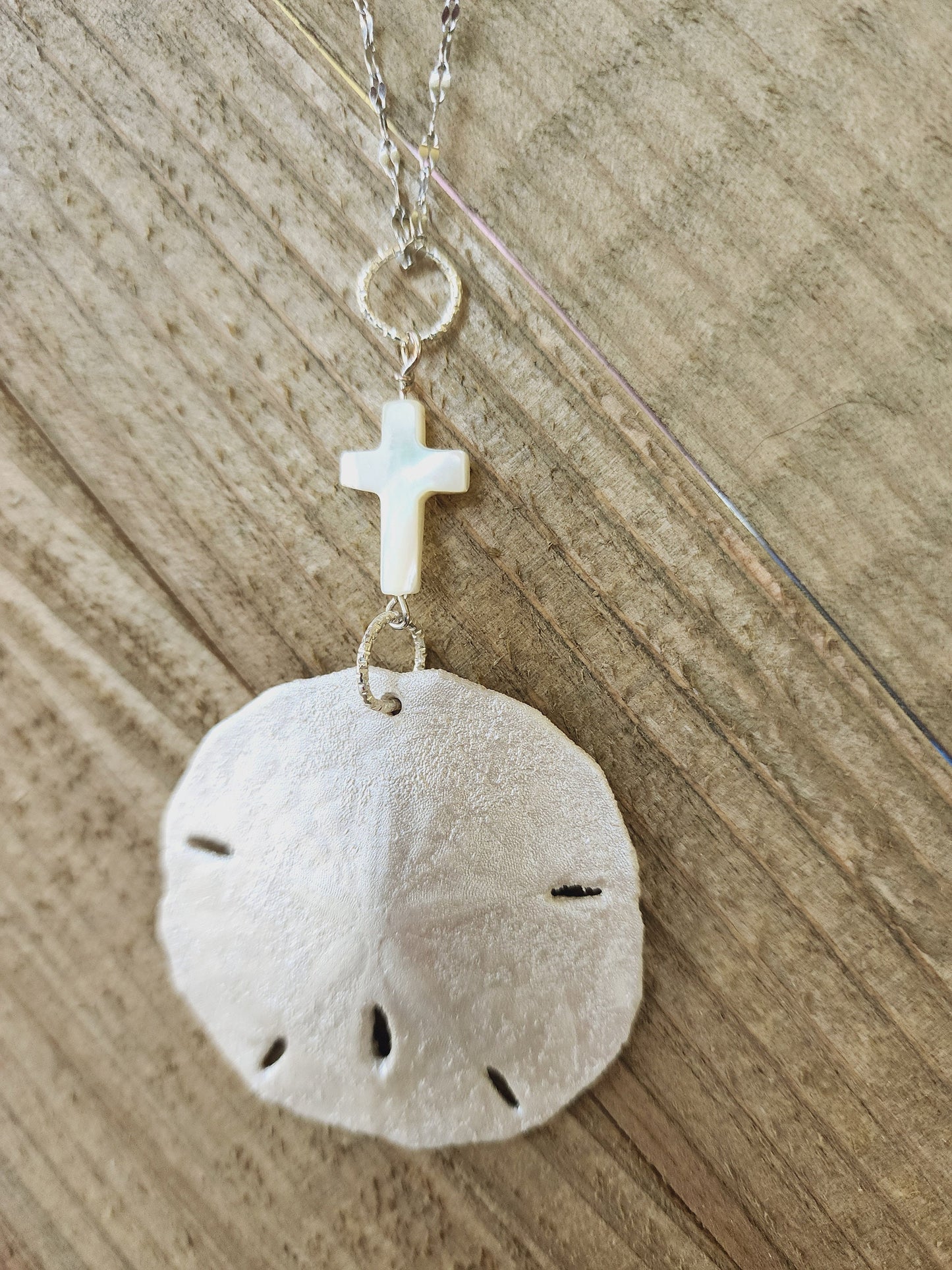Real handmade sand dollar necklace, accented with an ivory genuine shell cross charm. Perfect for an Easter gift or Easter accessory.