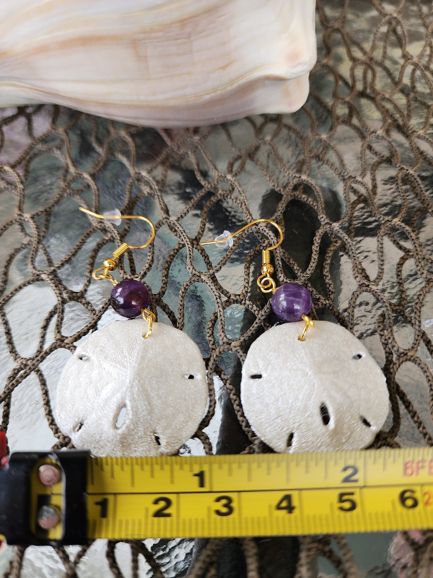 Real handmade sand dollar necklace and earring set accented with amethyst and fresh water pearl beads. Sand dollar pendant and earrings set