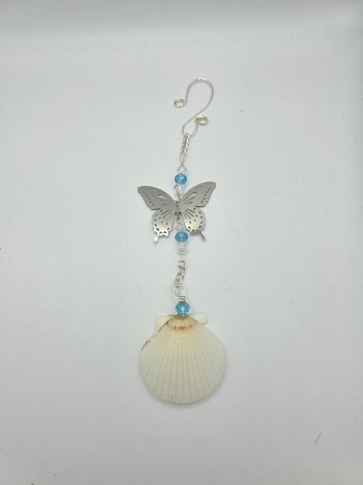 Seashell suncatcher, car charm with butterfly, blue and iridescent glass beads, and natural Florida scallop seashell. Approximate 10" long.