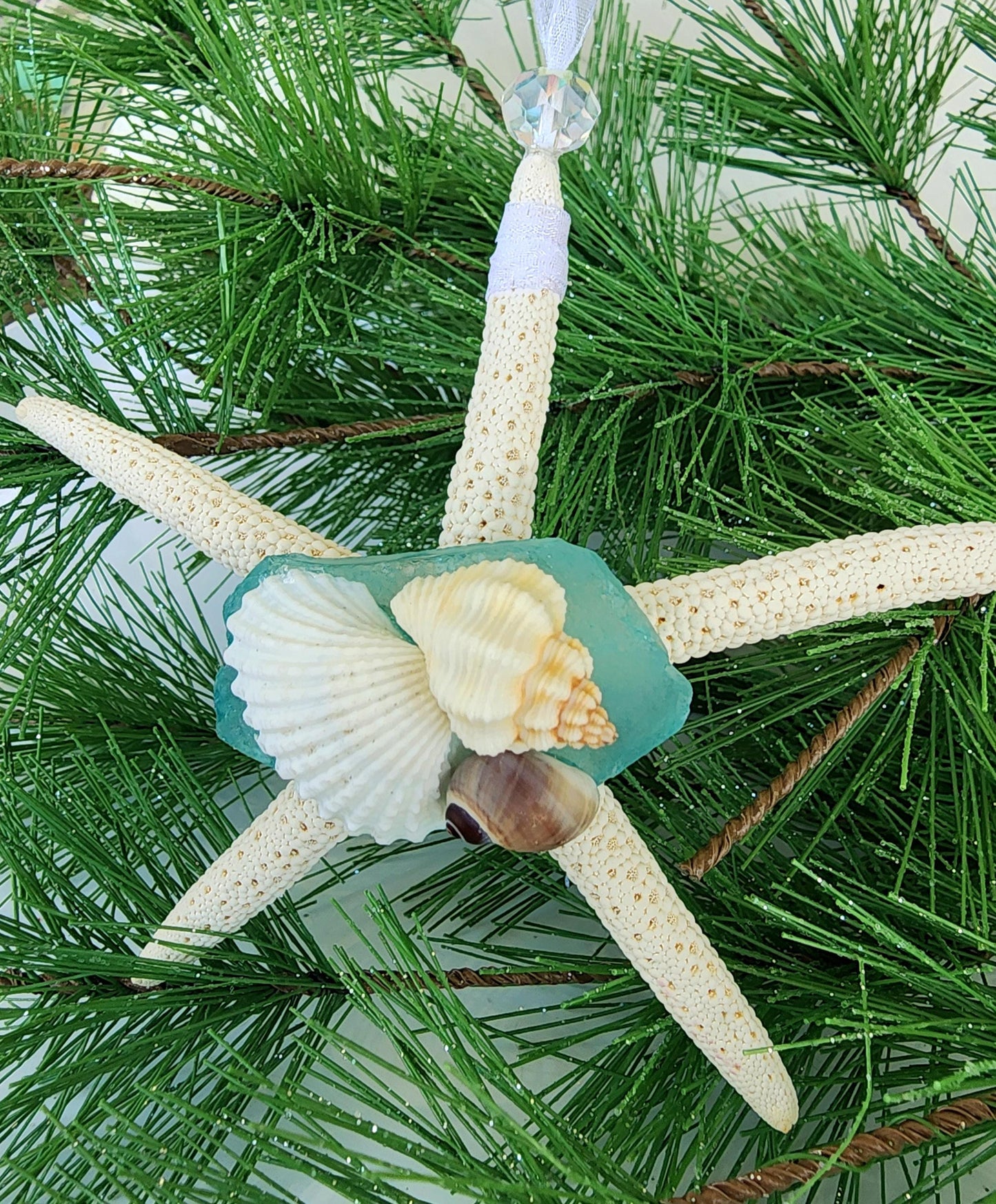 Starfish, sea glass and seashell holiday beach ornament. Aqua seaglass with natural pencil starfish and seashells. Approx 4-5 inch startish.