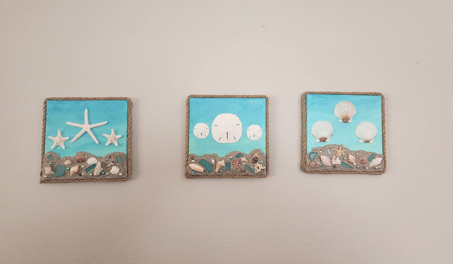 Hand painted 8x8 beach canvas made with genuine local sand and shells with beautiful starfish, sand dollars and scallops, jute rope border.
