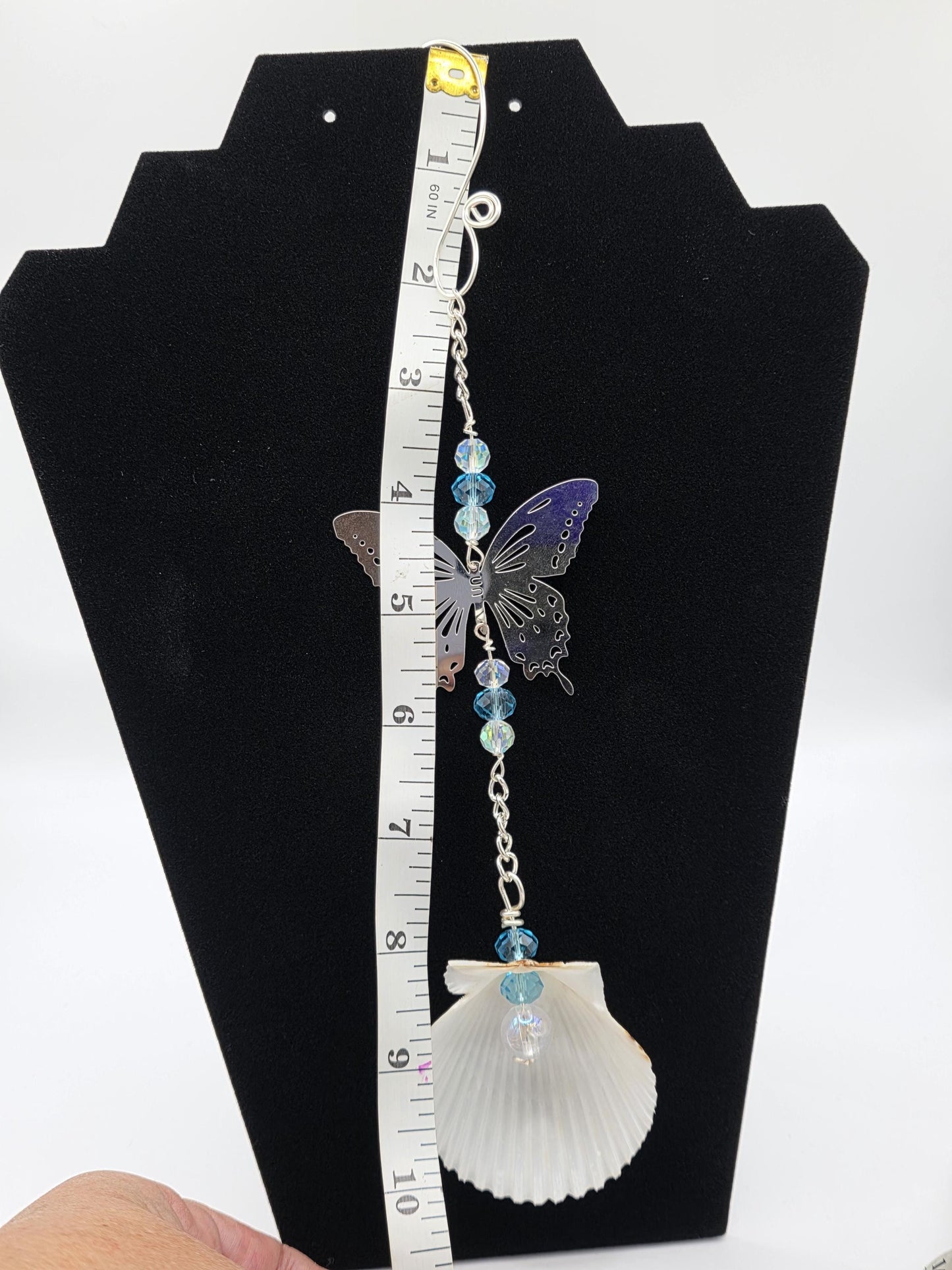 Seashell suncatcher, car charm with butterfly, blue and iridescent glass beads, and natural Florida scallop seashell. Approximate 10" long.