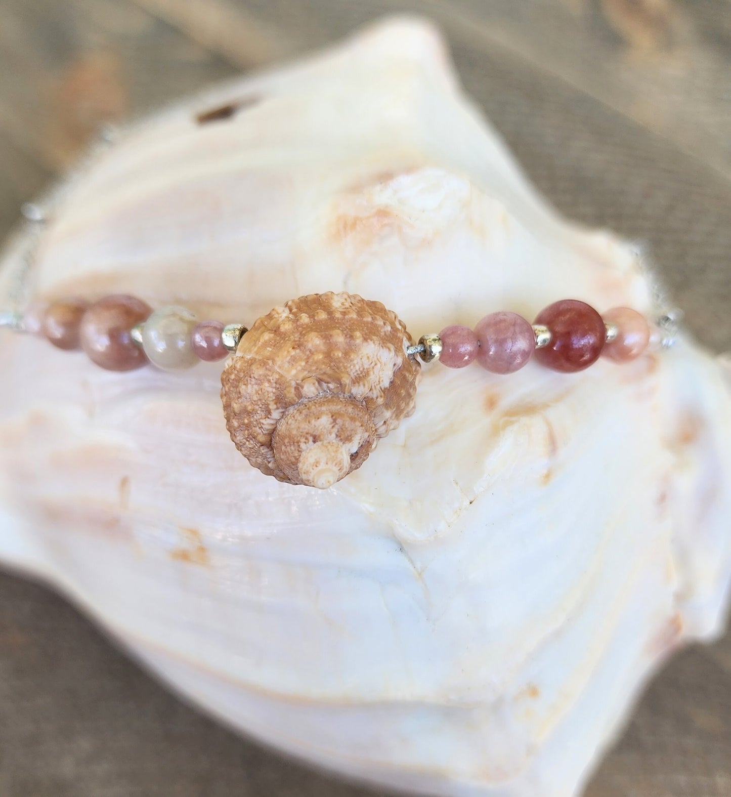 Genuine turban shell bracelet or anklet accented with semi-precious sun stone beads on silver beaded cable style stainless adjustable chain.