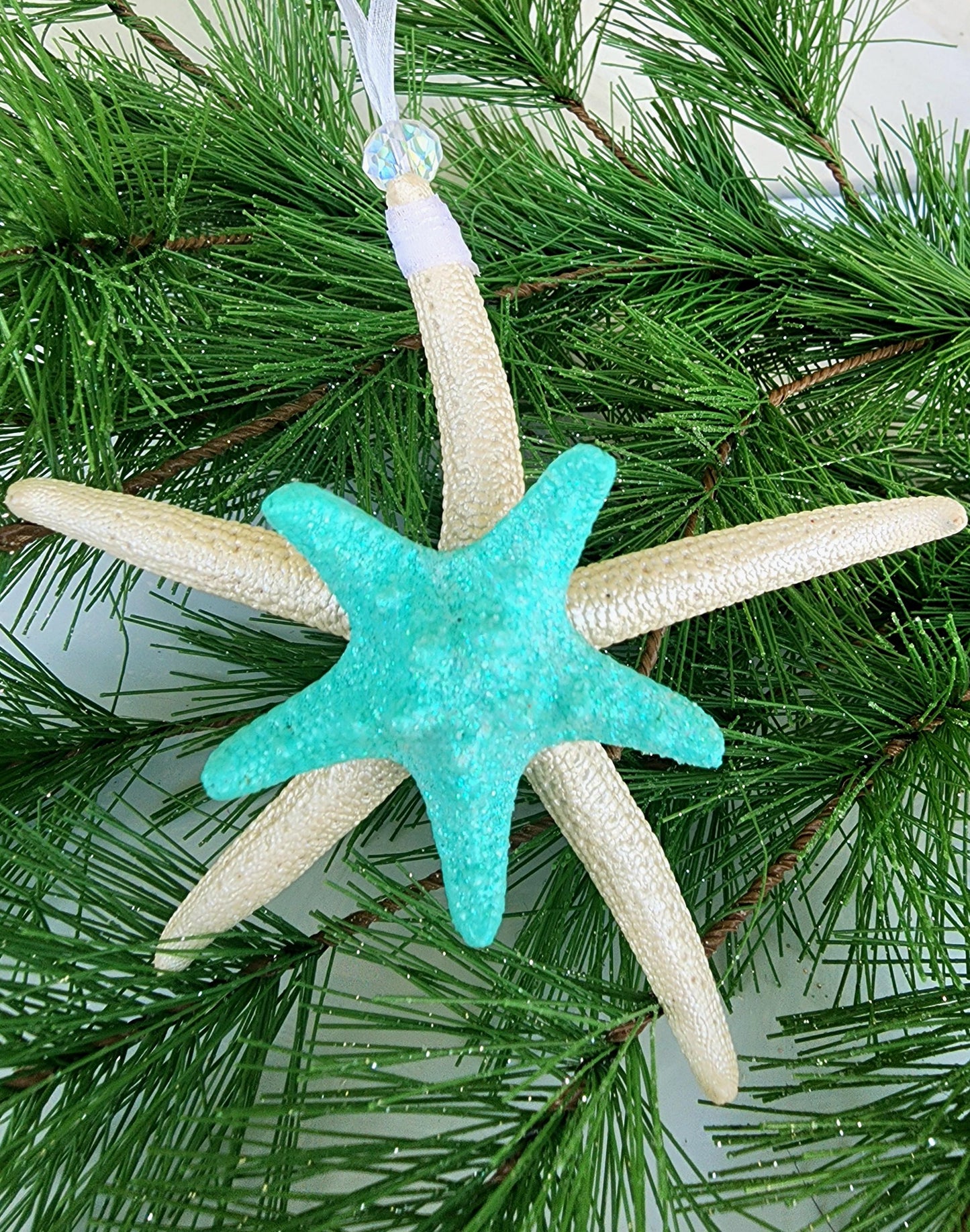 Starfish, sea glass and seashell holiday beach ornament. Aqua seaglass with natural pencil starfish and seashells. Approx 4-5 inch startish.
