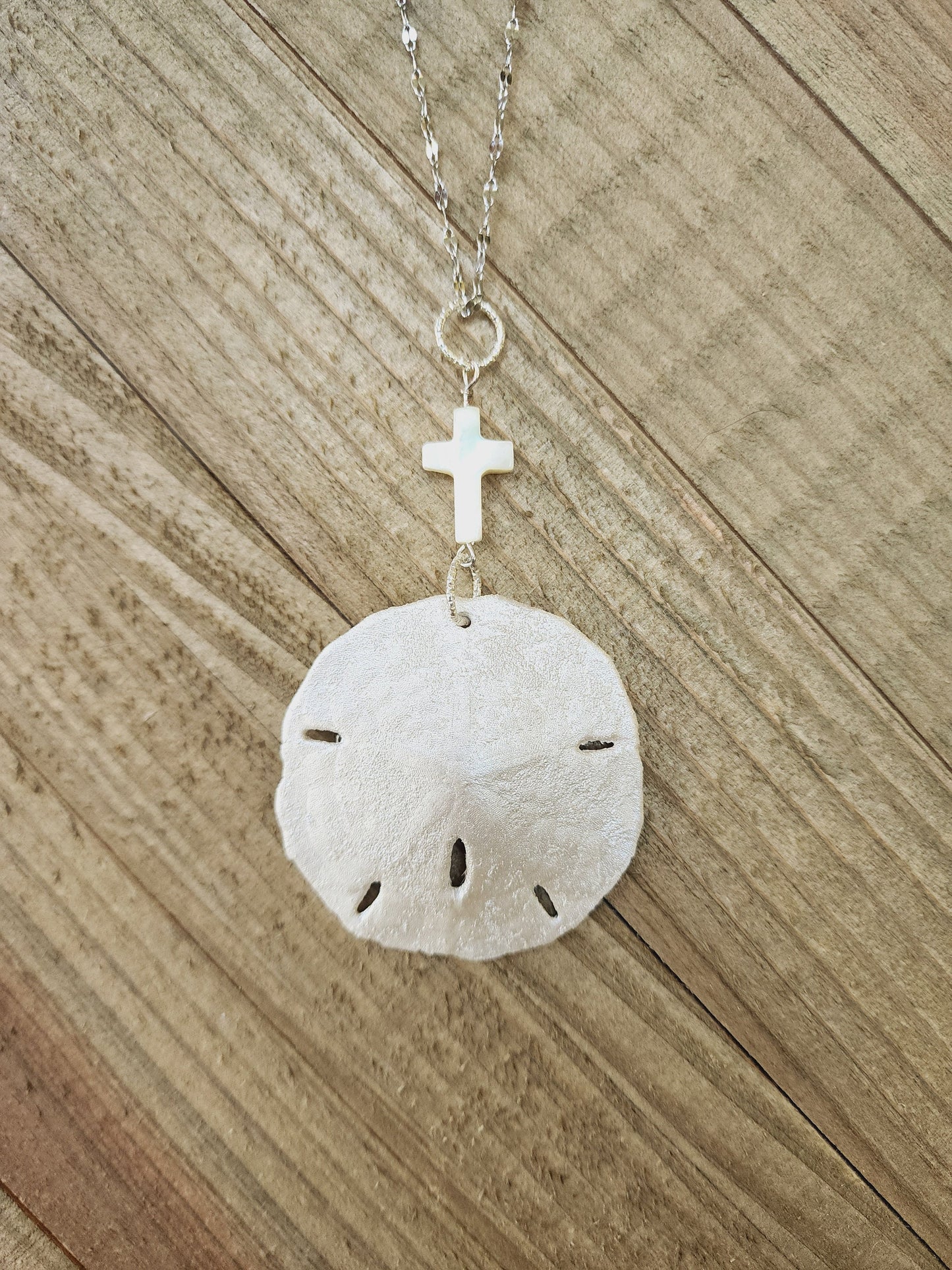 Real handmade sand dollar necklace, accented with an ivory genuine shell cross charm. Perfect for an Easter gift or Easter accessory.