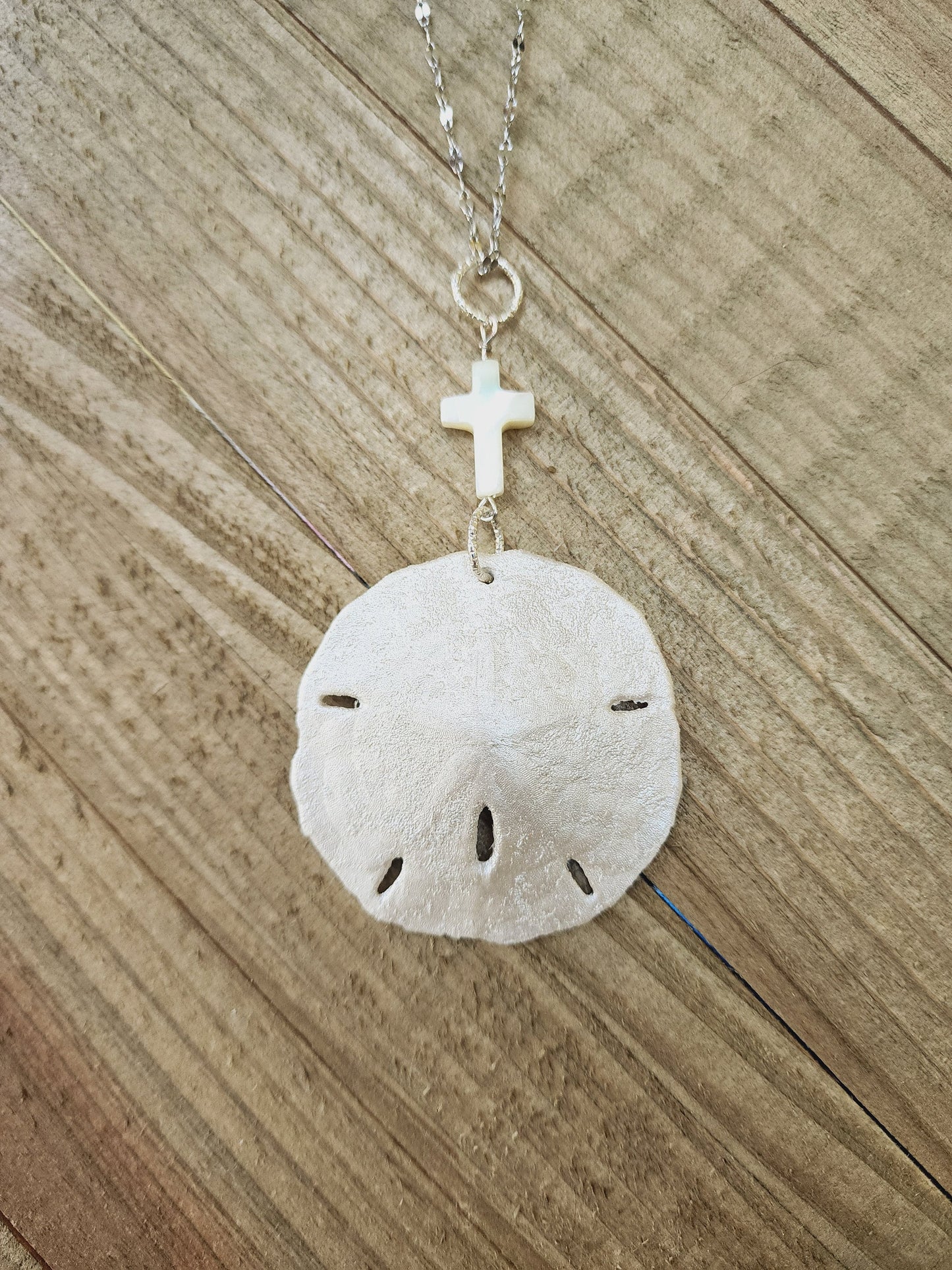 Real handmade sand dollar necklace, accented with an ivory genuine shell cross charm. Perfect for an Easter gift or Easter accessory.