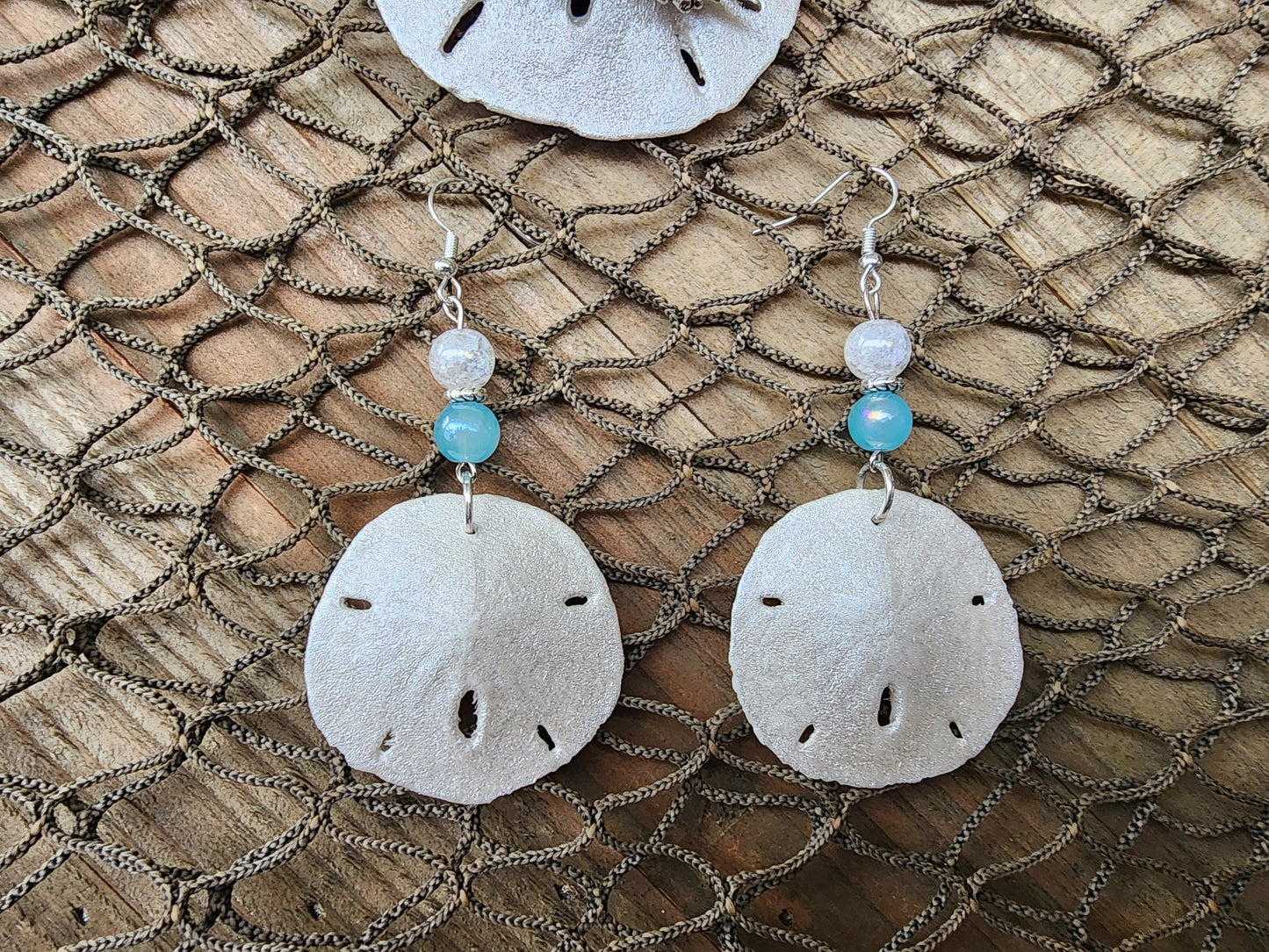 Handmade natural sand dollar necklace and earring set accented with aqua and white crackle beads. Perfect for beach wedding or bridesmaids.