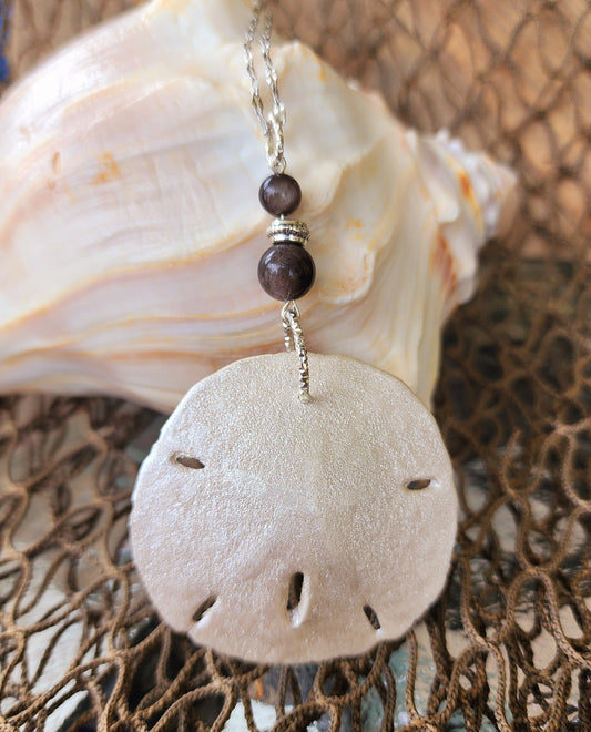 Stunning and elegant handmade sand dollar necklace and earrings set with silver obsidian bead accents. Sand dollar pendant and earrings set