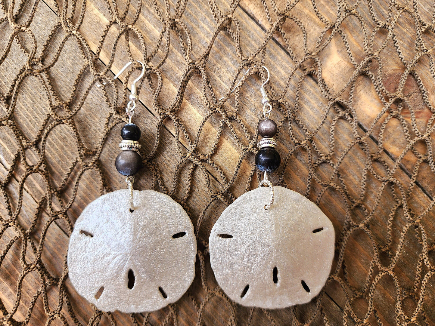 Stunning and elegant handmade sand dollar necklace and earrings set with silver obsidian bead accents. Sand dollar pendant and earrings set