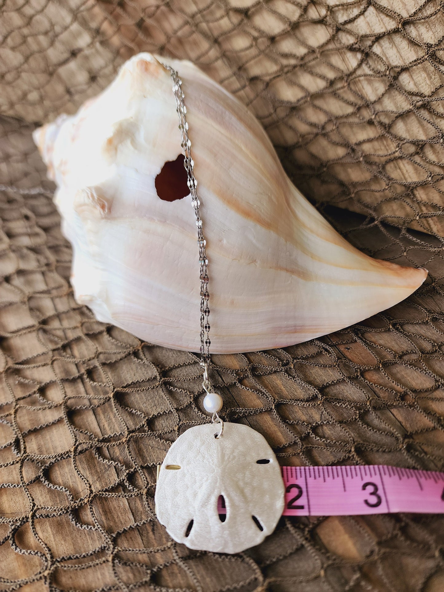 Handmade natural sand dollar necklace and earring set accented with aqua and white crackle beads. Perfect for beach wedding or bridesmaids.