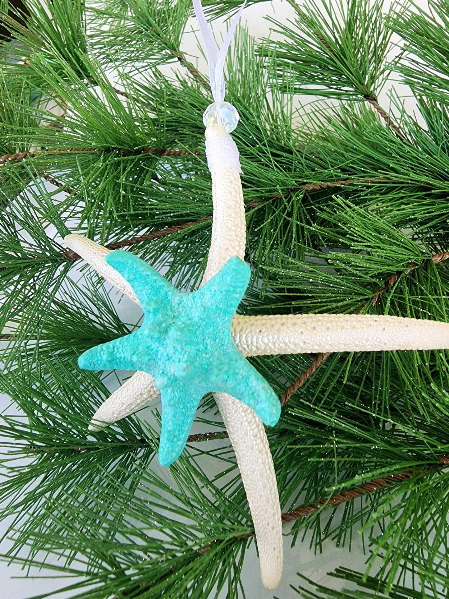 Starfish, sea glass and seashell holiday beach ornament. Aqua seaglass with natural pencil starfish and seashells. Approx 4-5 inch startish.
