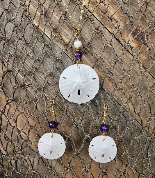 Real handmade sand dollar necklace and earring set accented with amethyst and fresh water pearl beads. Sand dollar pendant and earrings set
