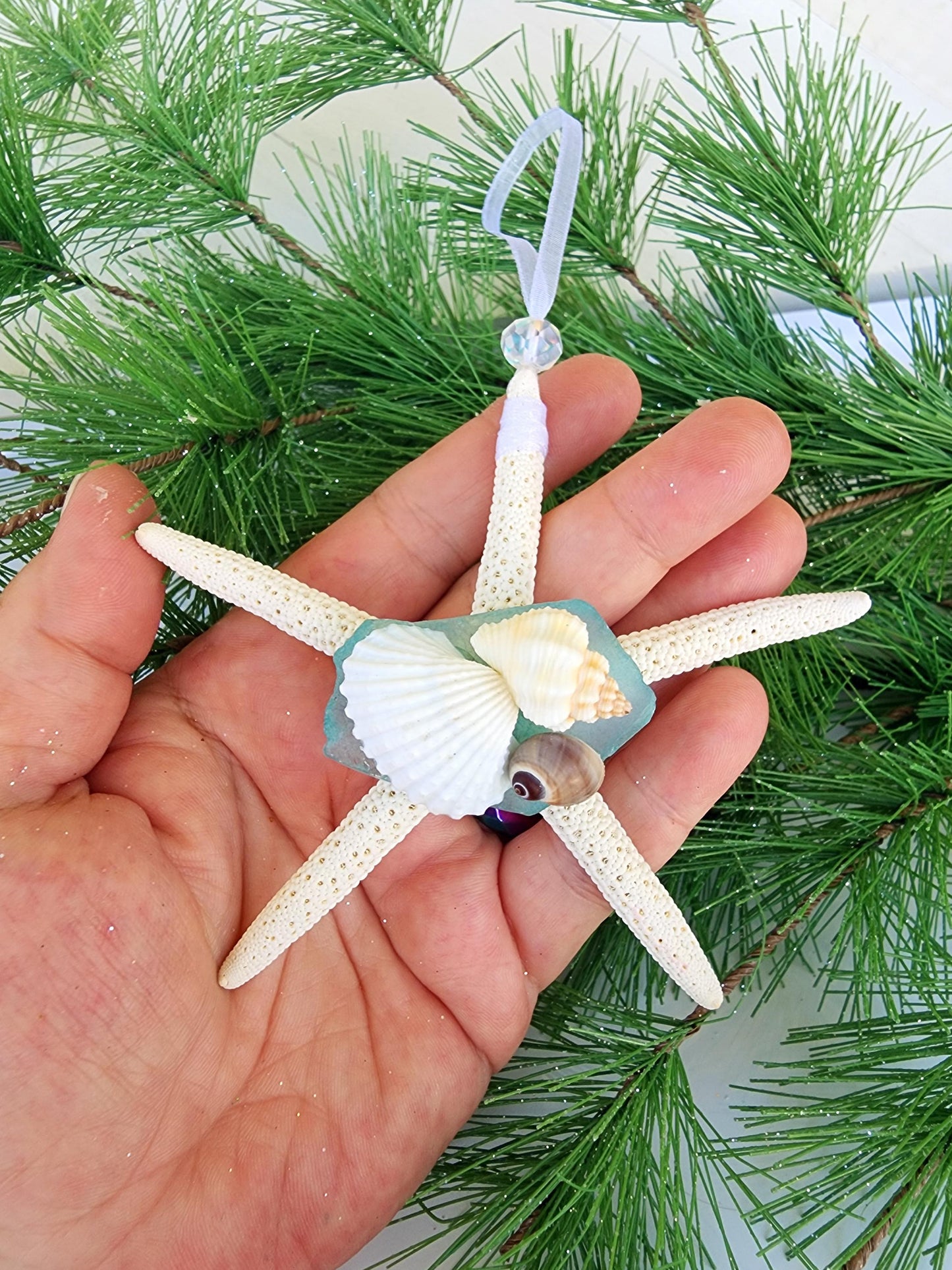 Starfish, sea glass and seashell holiday beach ornament. Aqua seaglass with natural pencil starfish and seashells. Approx 4-5 inch startish.