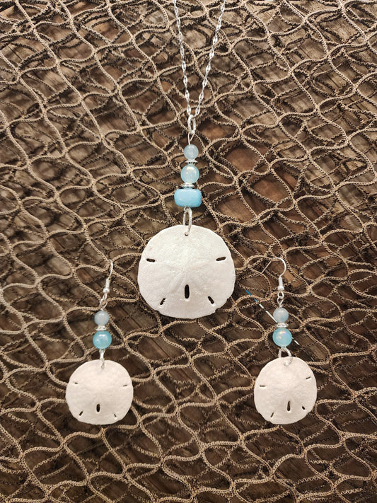 Genuine, natural handmade sand dollar pendant and earring set accented with beads in varying shades of blue. Beach jewelry set.