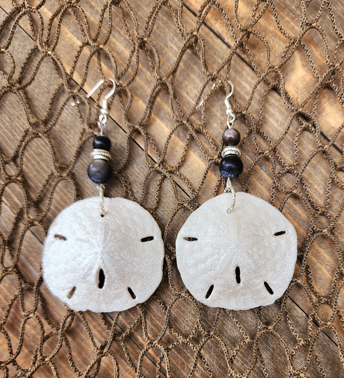 Stunning and elegant handmade sand dollar necklace and earrings set with silver obsidian bead accents. Sand dollar pendant and earrings set