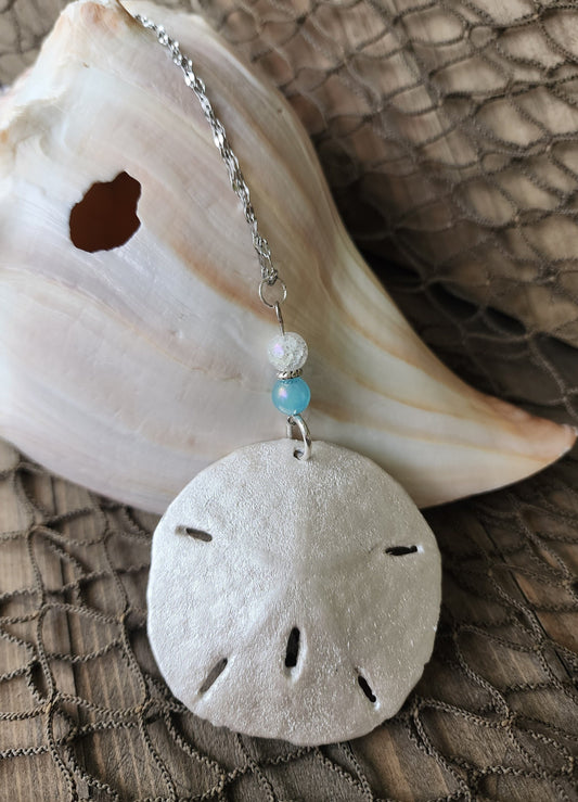 Handmade natural sand dollar necklace and earring set accented with aqua and white crackle beads. Perfect for beach wedding or bridesmaids.