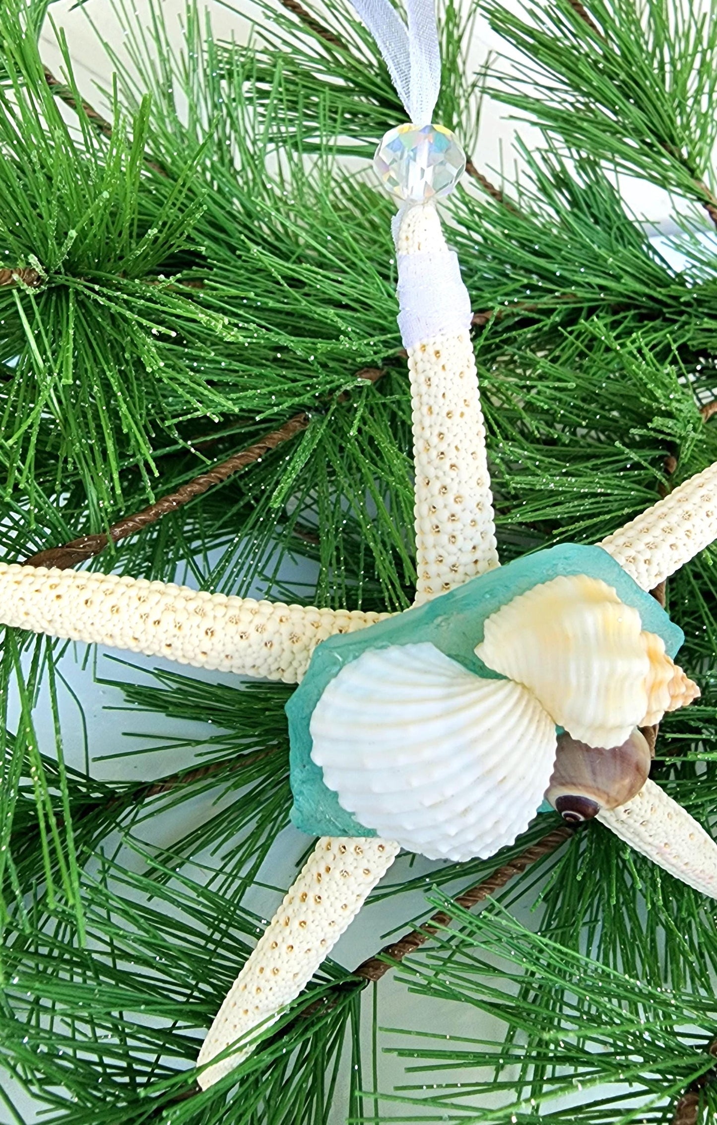 Starfish, sea glass and seashell holiday beach ornament. Aqua seaglass with natural pencil starfish and seashells. Approx 4-5 inch startish.