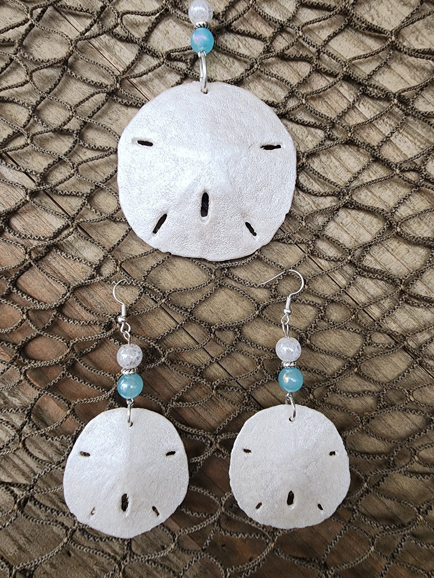 Handmade natural sand dollar necklace and earring set accented with aqua and white crackle beads. Perfect for beach wedding or bridesmaids.